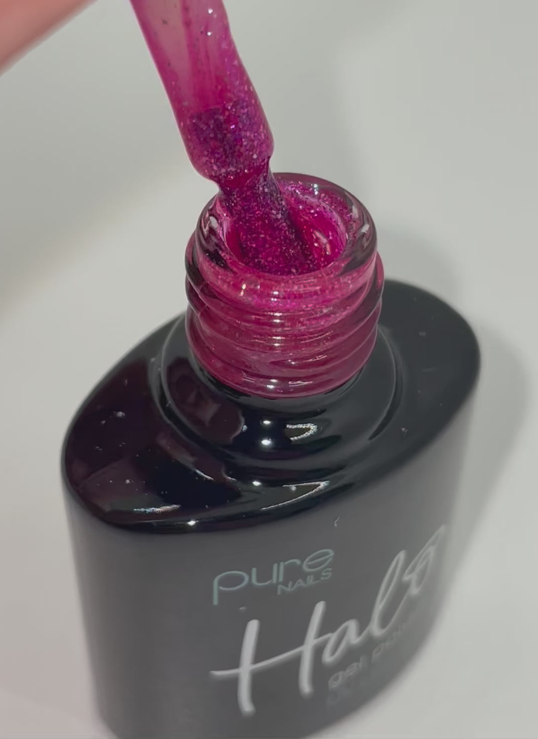 Product video of Pure Nails' Halo gel polish in shade 'Cerise Sparkle'